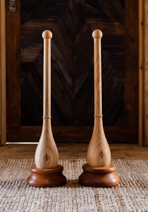 Hand-turned wooden bases for teardrop Indian clubs and tai chi balls