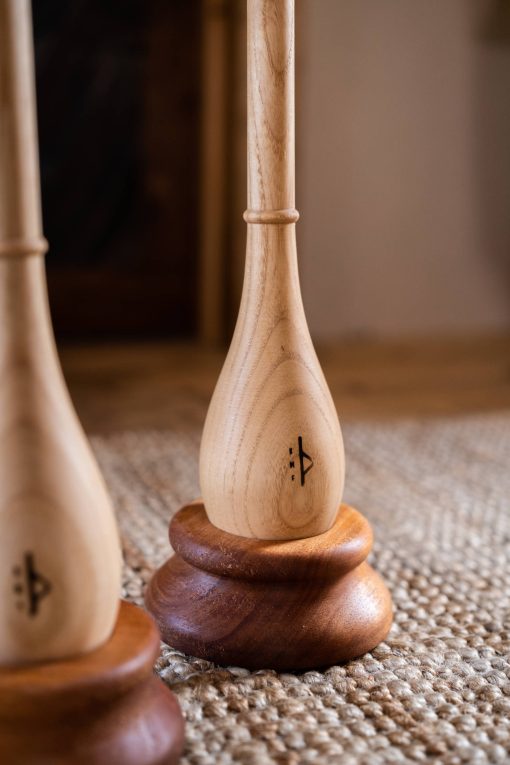 Hand-turned wooden bases for teardrop Indian clubs and tai chi balls