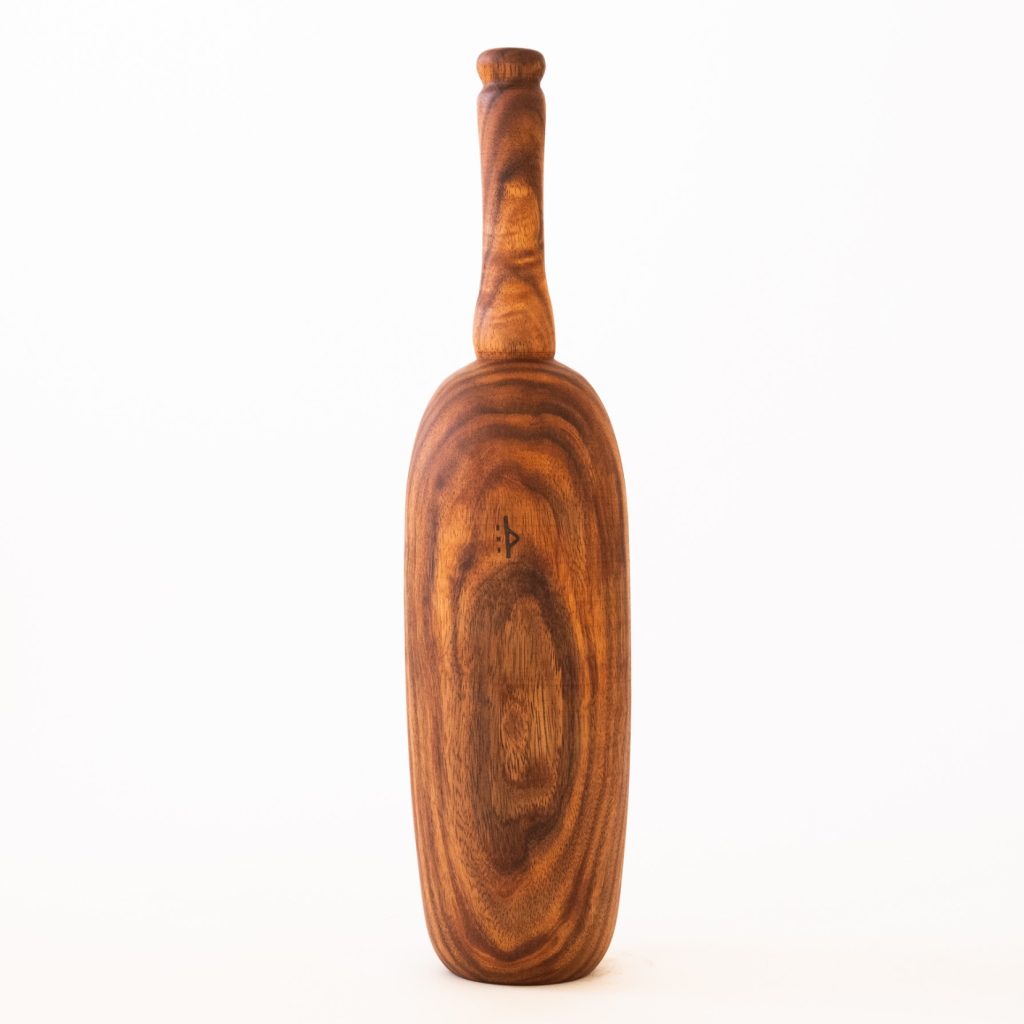 Photo of a Buja Karlai wooden club on a white background